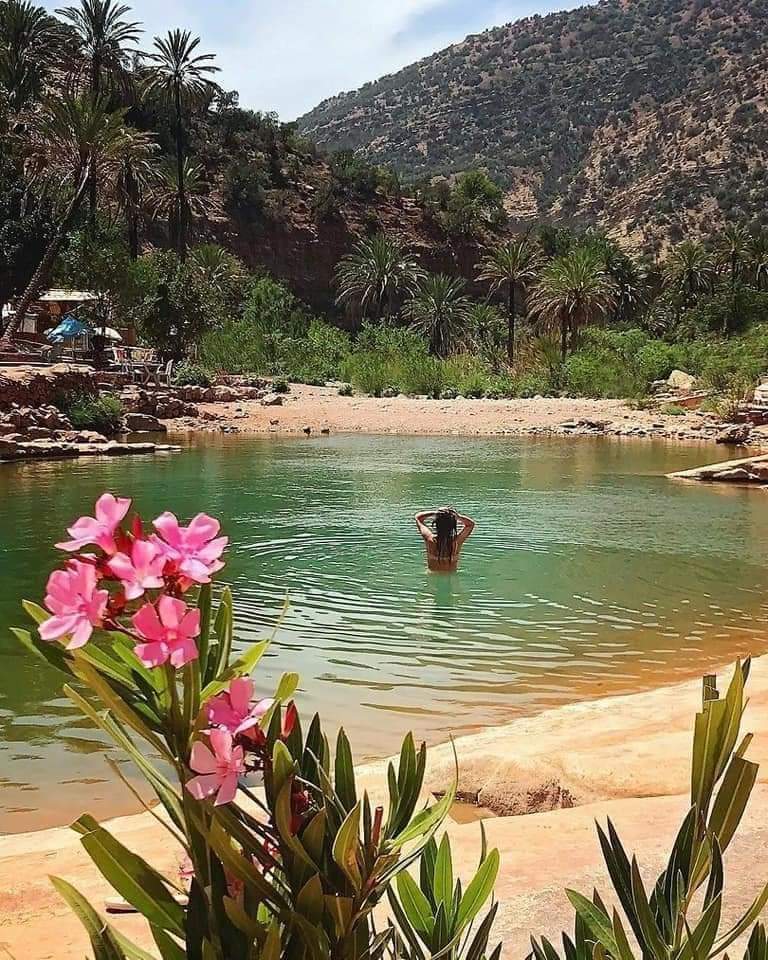 Hikers exploring lush trails and clear pools in Paradise Valley, Agadir.