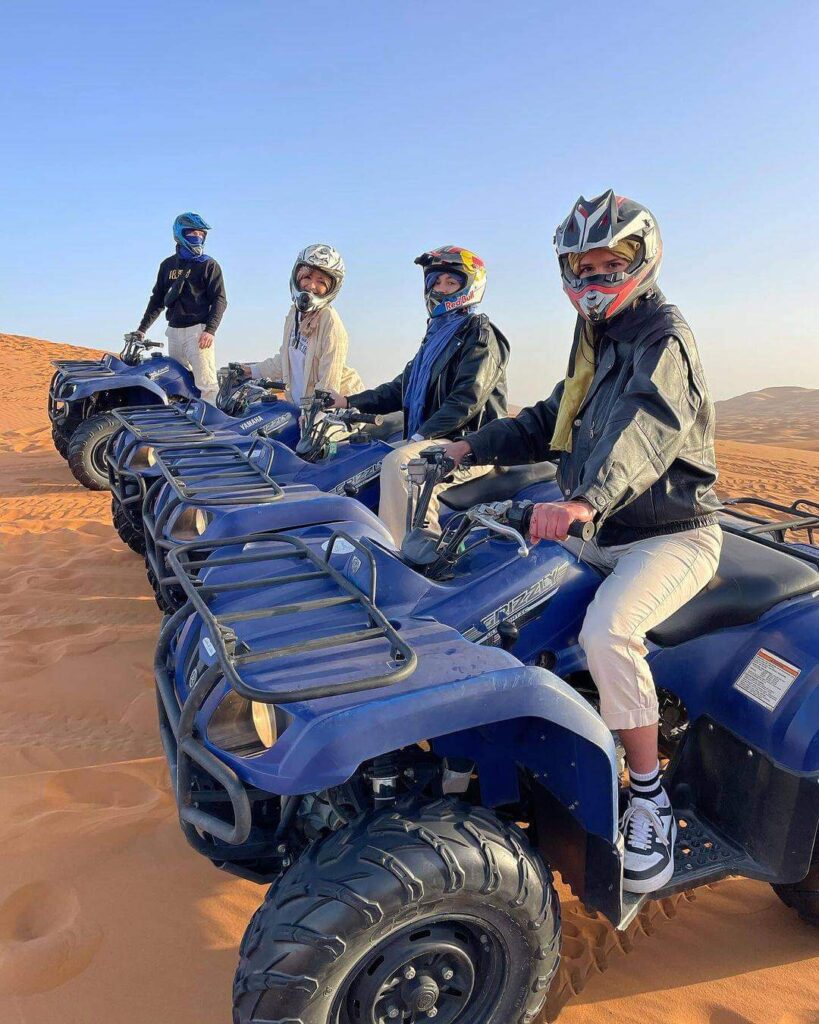 Adventurer riding a quad bike through Agadir’s scenic sand dunes.